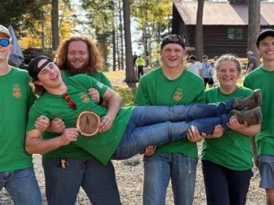 Logging sports team celebrates victory