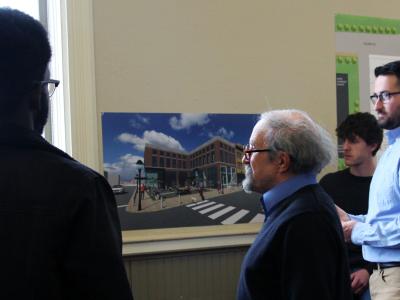Students speak with resident about architecture design