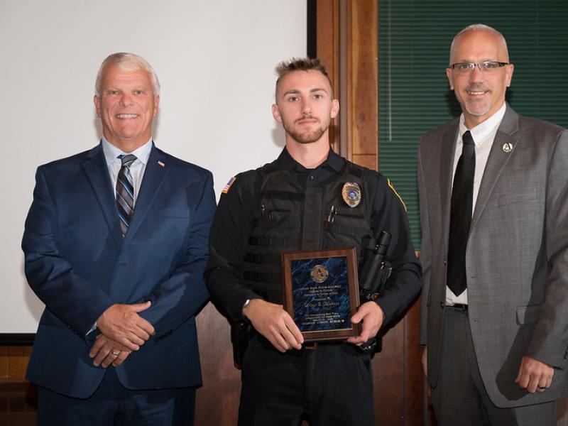 Graduating cadet with his award