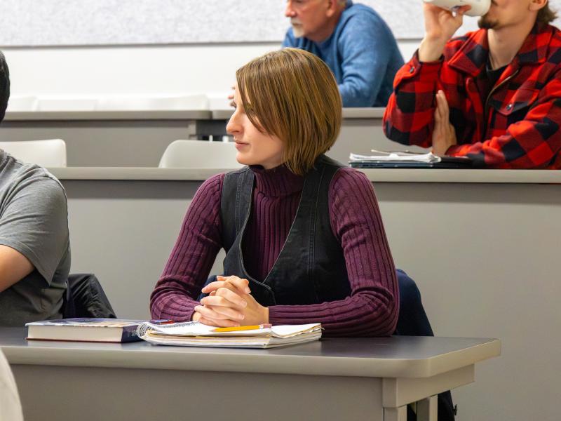 student looks on in a class