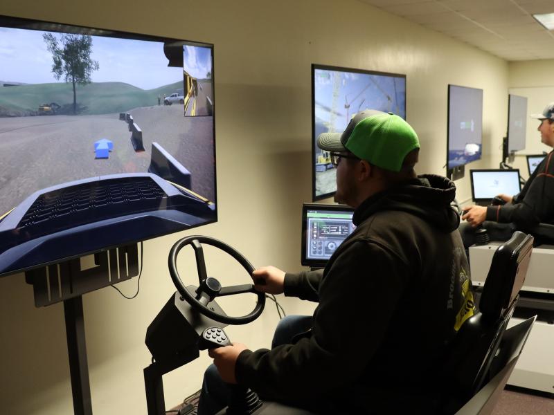 students use heavy equipment simulators