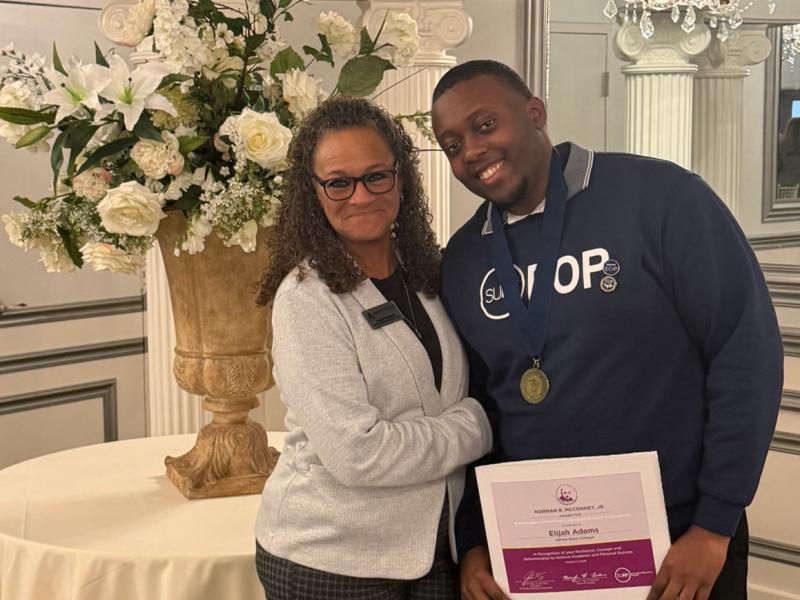 Elijah Adams stands with EOP Director Nadine Shardlow