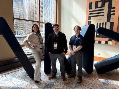 students pose with their professor