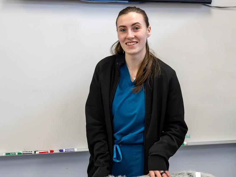 student in a vet tech lab.