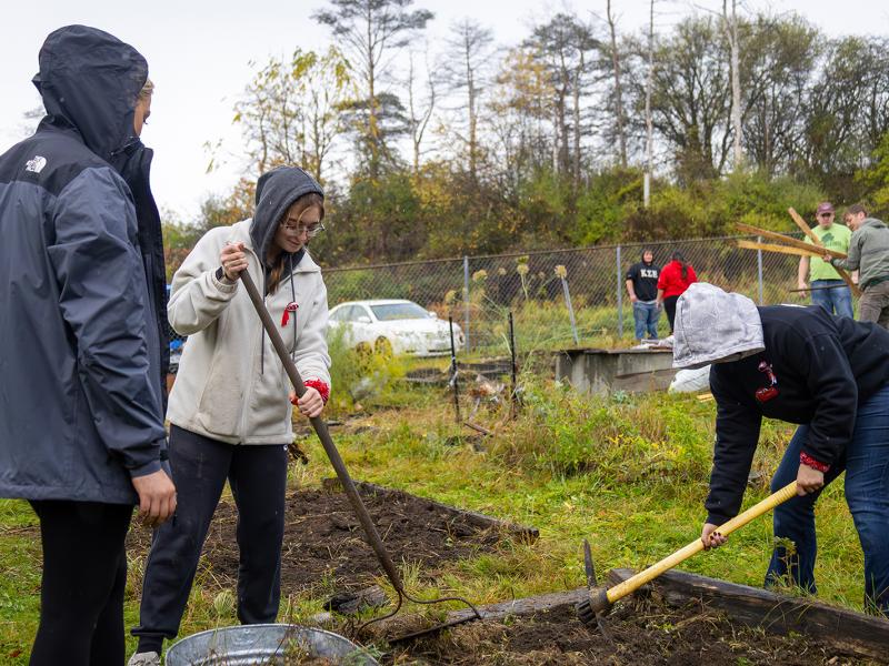 students work in the community garden
