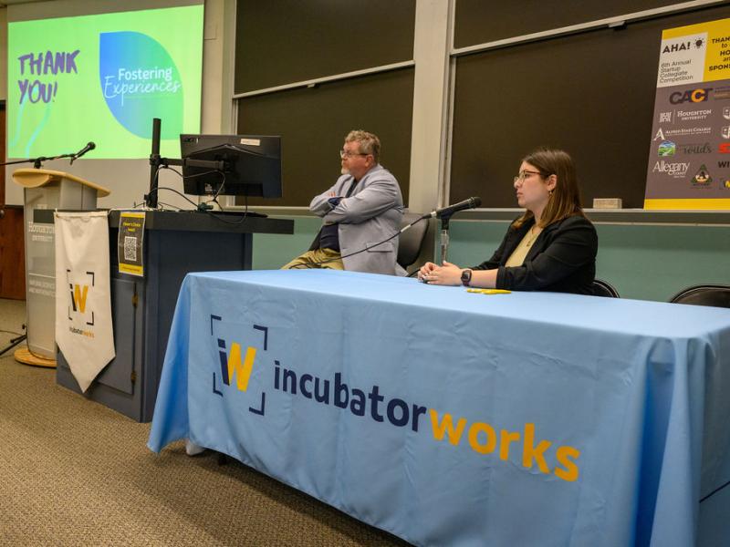 Students answers questions at a pitch competition