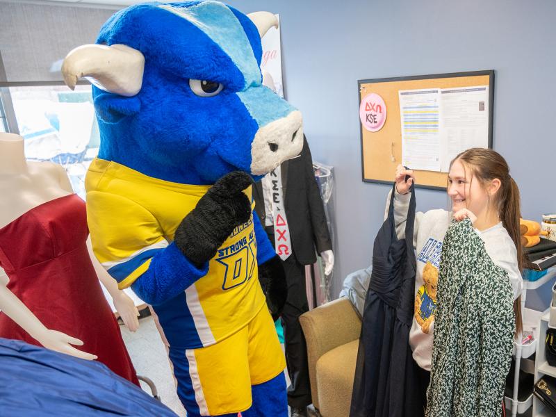 Big Blue checks out some dresses from Project Prom Dress