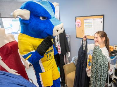 Big Blue checks out some dresses from Project Prom Dress