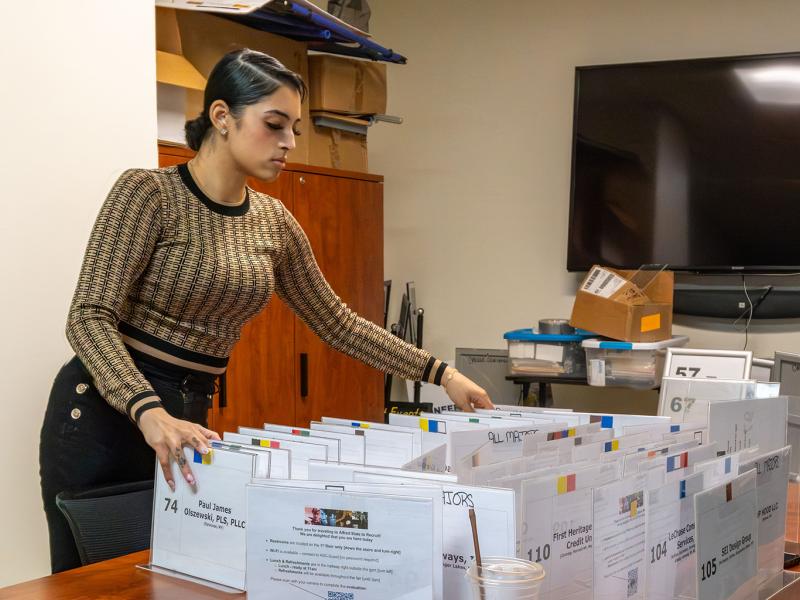 student works preparing for a recent career fair