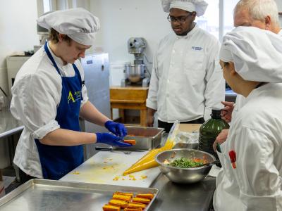 Students work in the kitchen