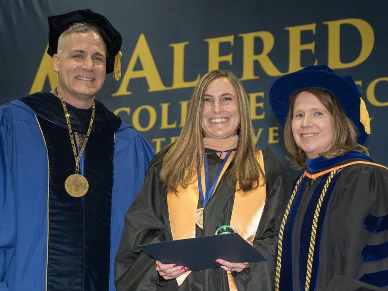 Danielle Green was honored with an award, presented by Dr. Mauro and Danielle Green