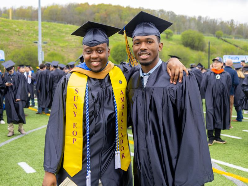Elijah Adams and a friend at commencement