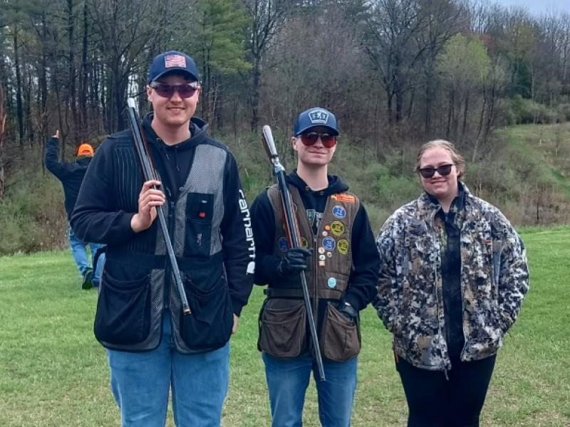 student pose after shooting a round for the Trap Team