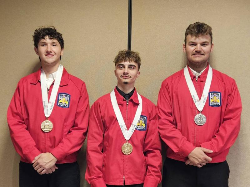 Three Alfred State students display their medals after competing in the SkillsUSA Competition