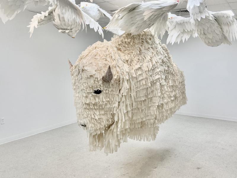 life-size buffalo and seagull puppet