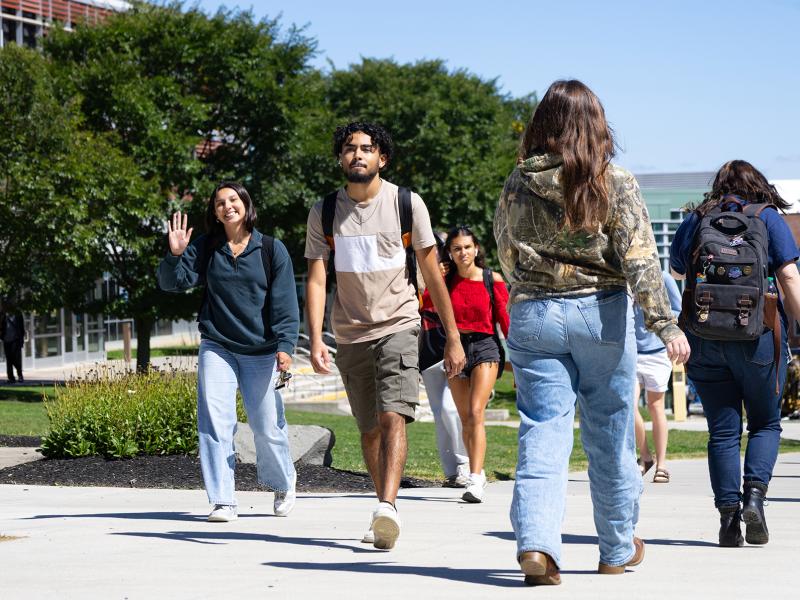 students walking on the spine of campus