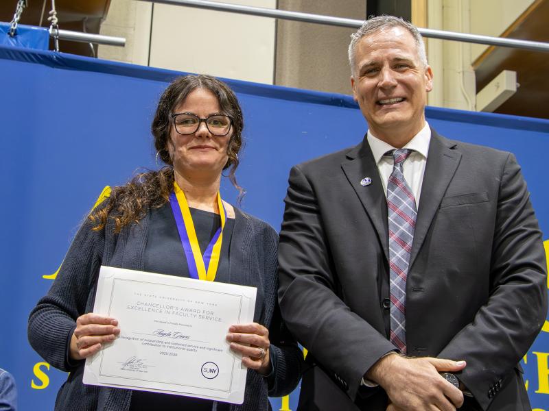 Dr. Graves with President Mauro after receiving an award