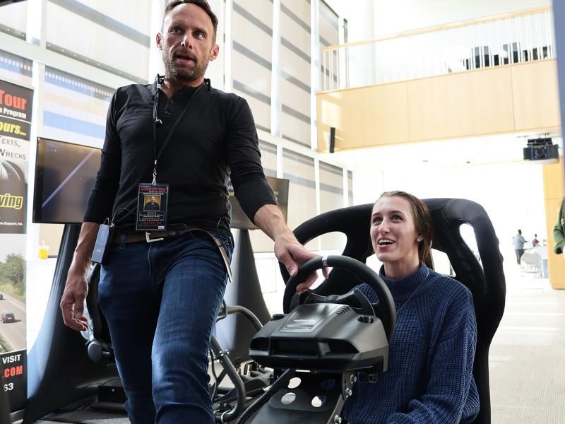 student participates in a simulation car at the Safe a Life Tour stop.
