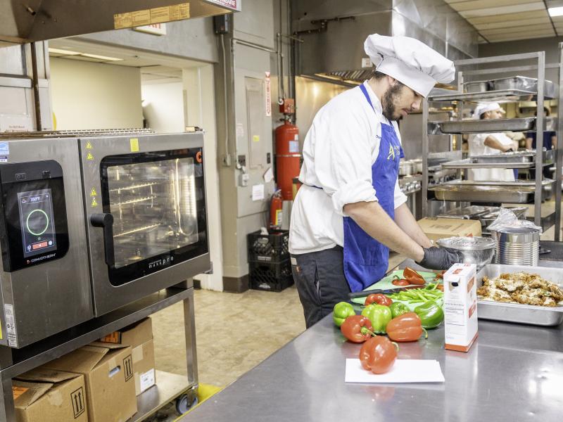 Student cutting in the kitchen