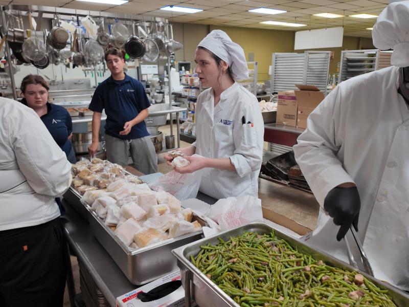 Students work to prepare a meal