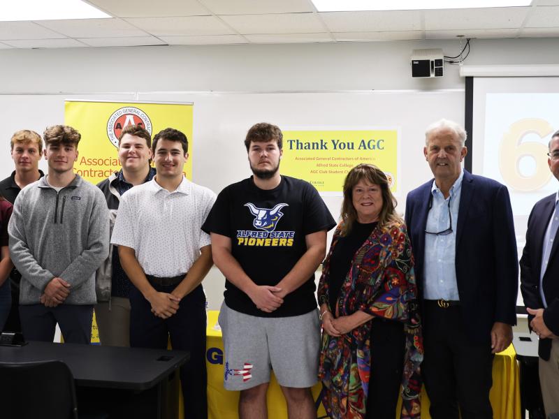 Scholarship winners pose with members of AGC of NYS