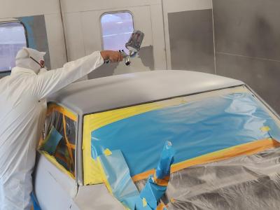 An Alfred State student works on the paint job for the 1969 Pontiac Firebird Trans Am.