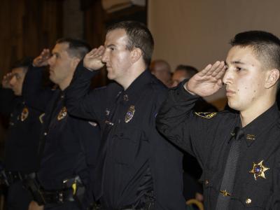 Cadets salute during a ceremony