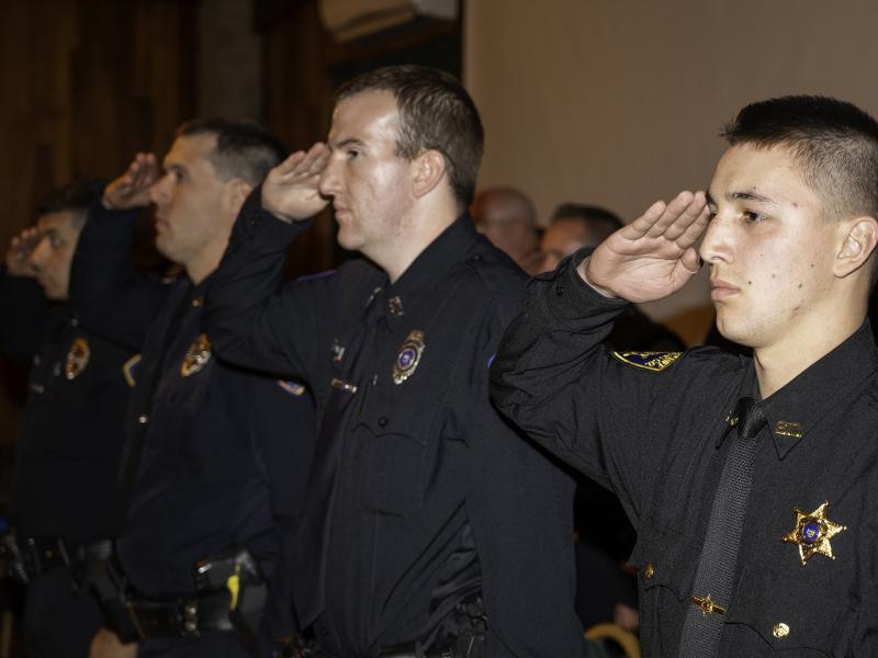 Cadets salute during a ceremony