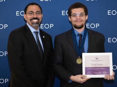 Student accepts award from SUNY Chancellor