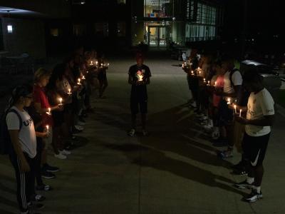 Students in UJIMA host a candle light memorial for the victims of 9/11