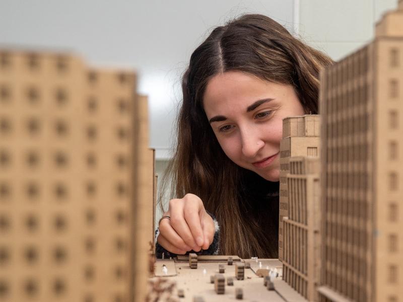 student works on an architectural model