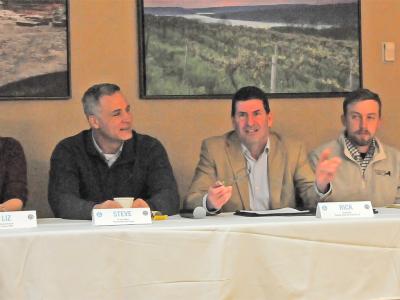 Panel of presenters at a architecture event.