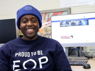 Student sits in front of a computer