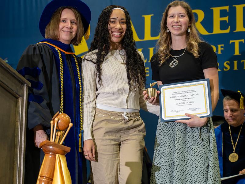 Morgan McLean accepts an award