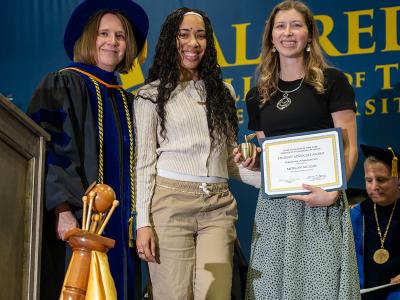 Morgan McLean accepts an award