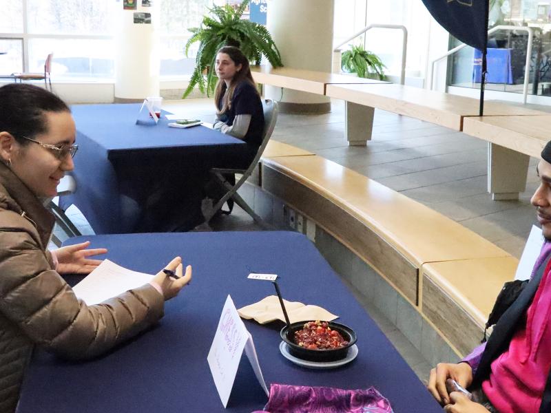 A student ask questions of the actor playing Chessy during a Clue event.