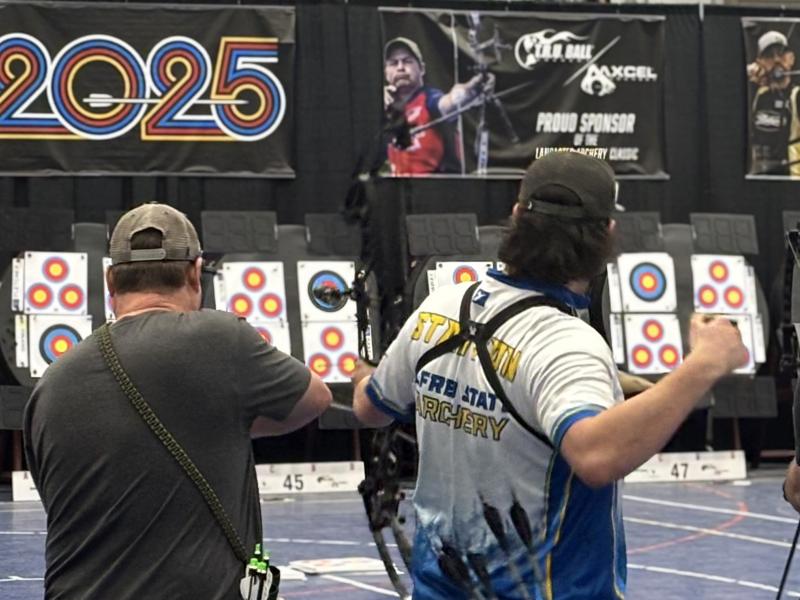 student shoots an arrow