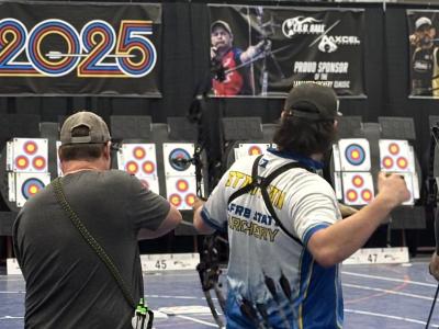 student shoots an arrow