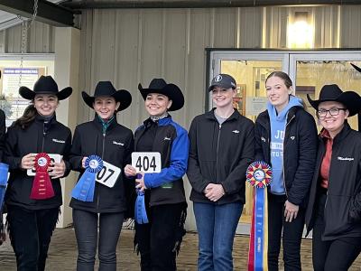 Alfred State riders display their awards from their season opening event.