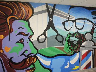 ART at ASC includes a new mural in the barber shop and styling space at Pioneer Center.