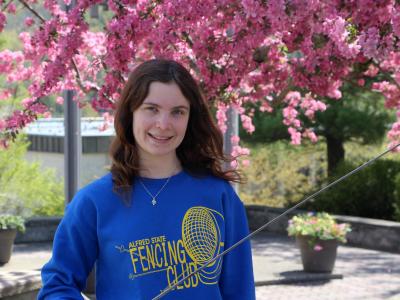 Amanda Brady stands in bell tower plaza