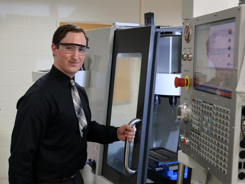 student works on a machine