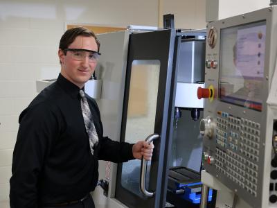 student works on a machine
