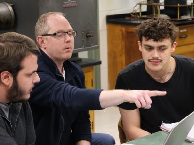 Professor Bryant works with students