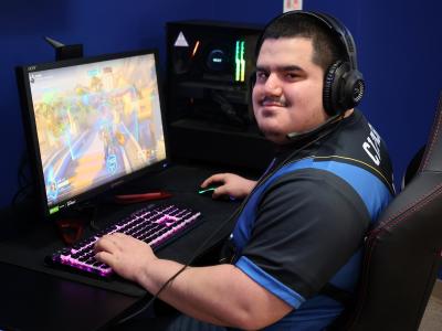 student playing video games at a computer