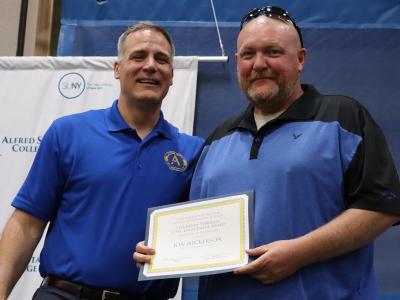 Jon Nickerson receives award from Dr. Mauro