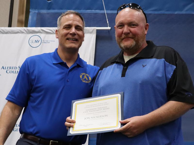 Jon Nickerson receives award from Dr. Mauro