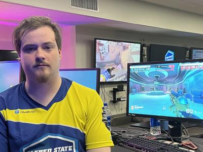 Austin Clay sits in front of a laptop prior to playing in an Esports competition.