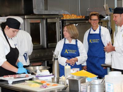 Students work with faculty in the kitchen