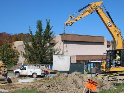 Cranes work outside of the Orvis Activities Center on the infrastructure project. Alfred State has $100 millions dollars of improvement underway. 